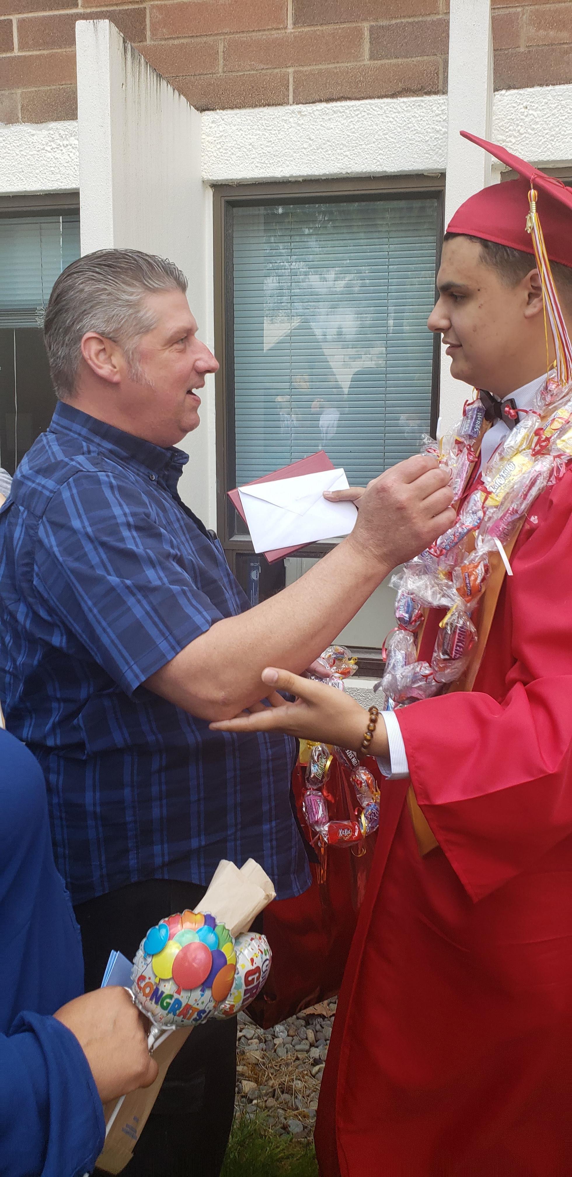 A family gathers to celebrate a graduate's achievement with gifts and heartfelt conversations.