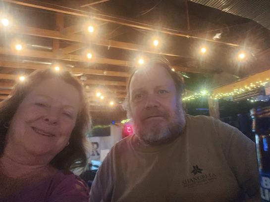 A man and woman smiling for a picture