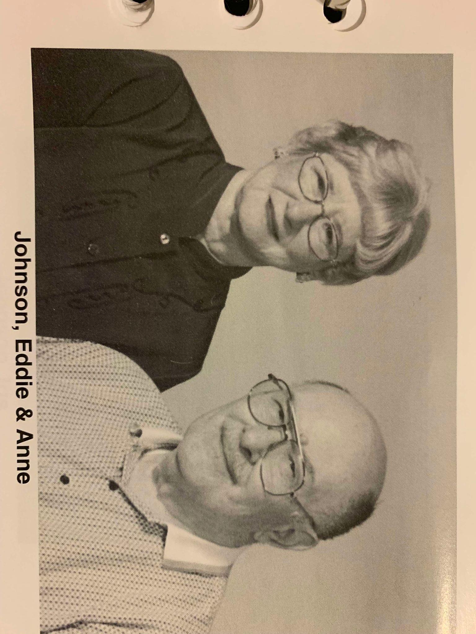 Eddie and Anne Johnson smile warmly at the camera, highlighting their bond in a simple studio.