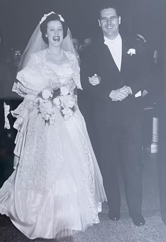 A man and woman in wedding attire