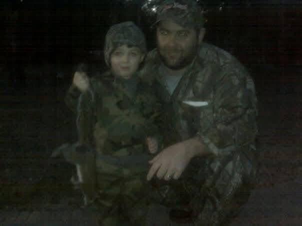 A man and child in military uniforms