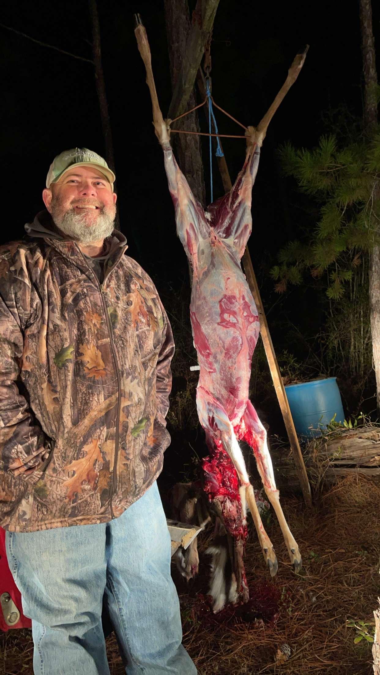 A man standing next to a rabbit