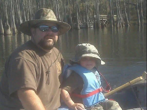 A man and child on a boat