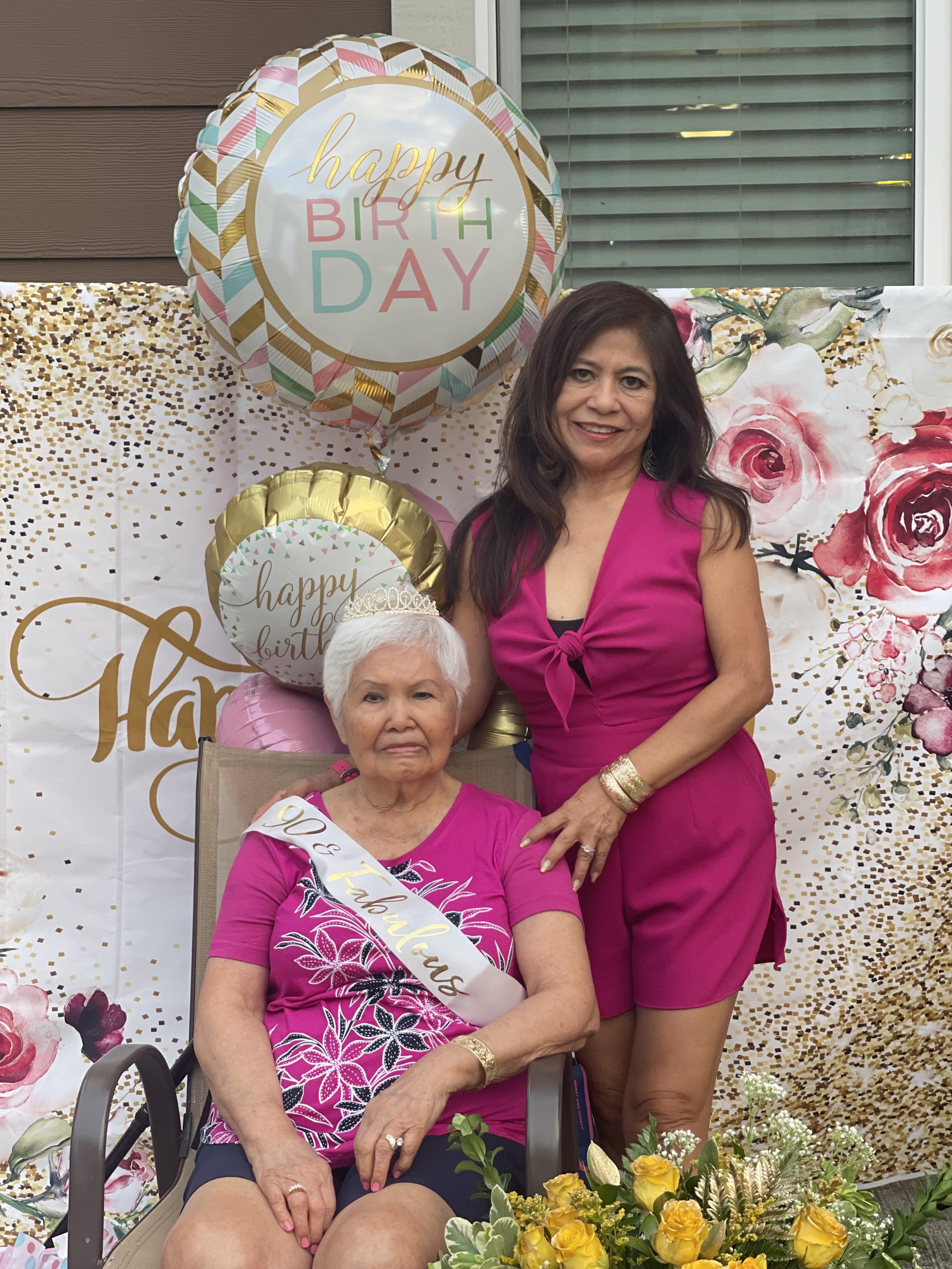 Family gathers to celebrate a grandmother’s birthday with decorations and joyful moments.