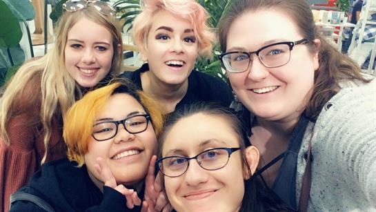 A group of women smiling for a selfie