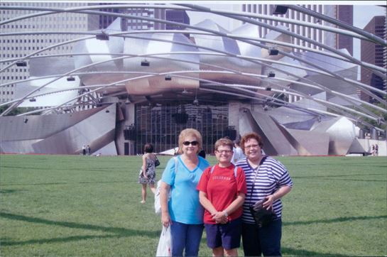 A group of people standing in front of a building
