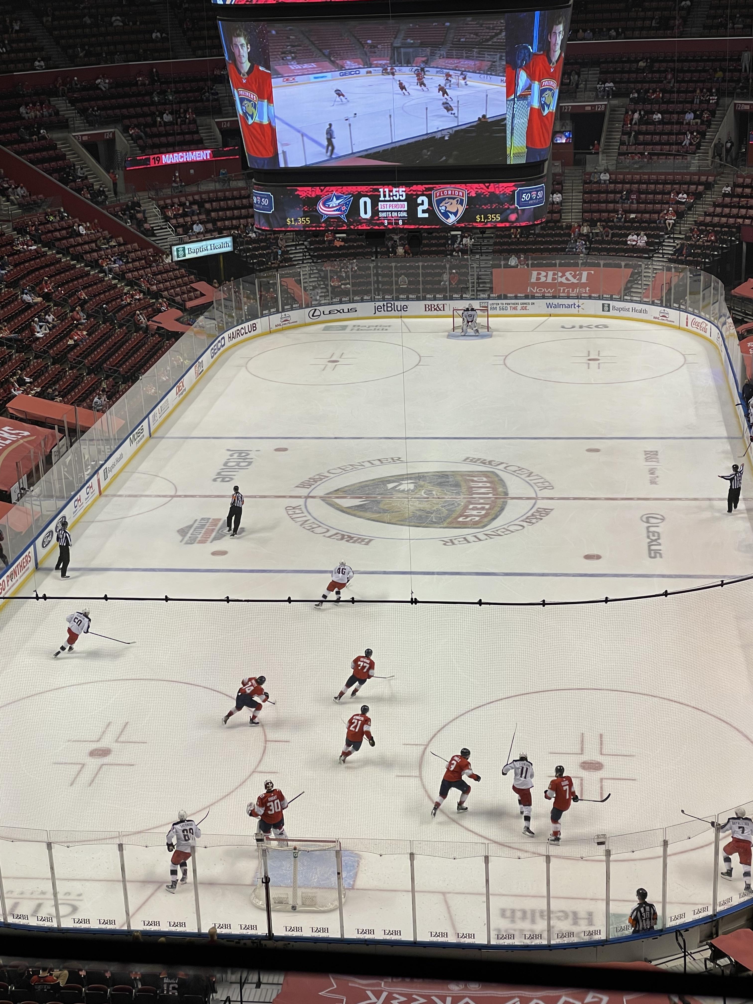 High-energy hockey action unfolds in a crowded arena during the thrilling game.