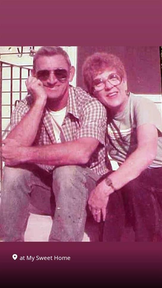 A man and woman posing for a picture