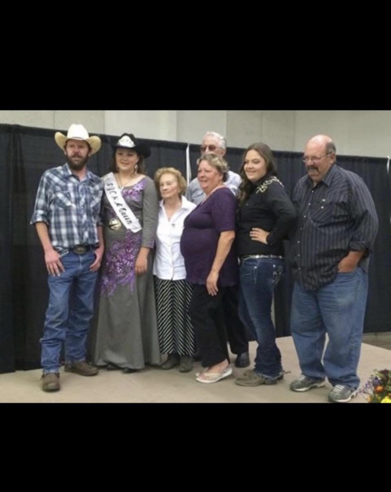 Friends and family celebrate a special occasion in festive attire at the community center.