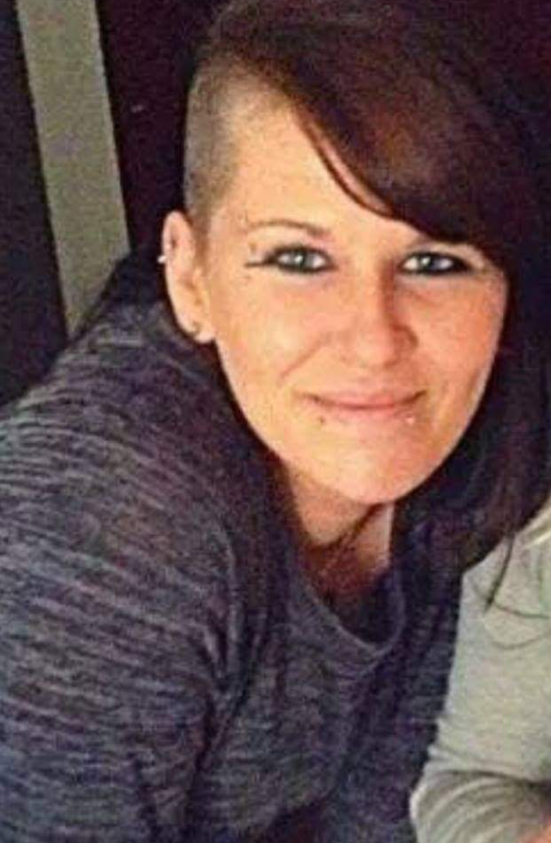 A woman smiling at the camera