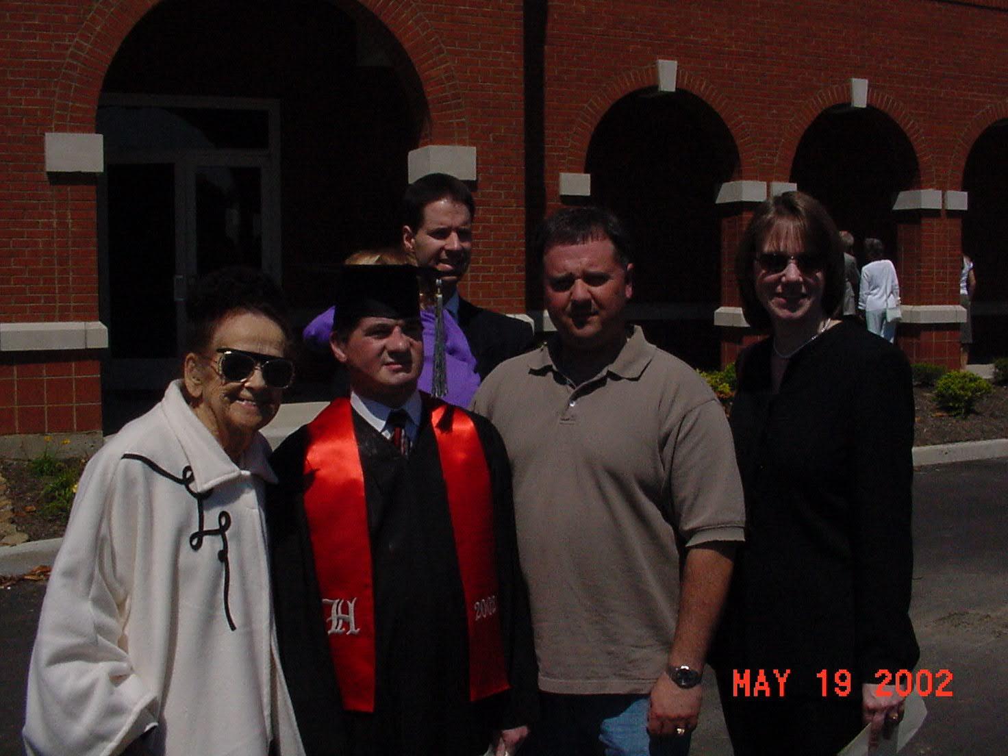 Family gathers to celebrate a graduation.