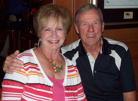 A man and woman smiling