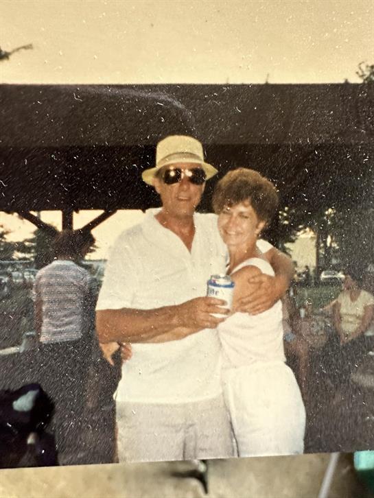 A man and woman hugging and smiling
