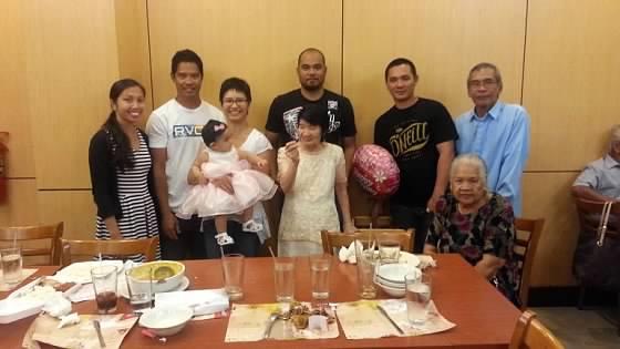 A joyful family celebration takes place at a restaurant with smiling faces and warm moments.