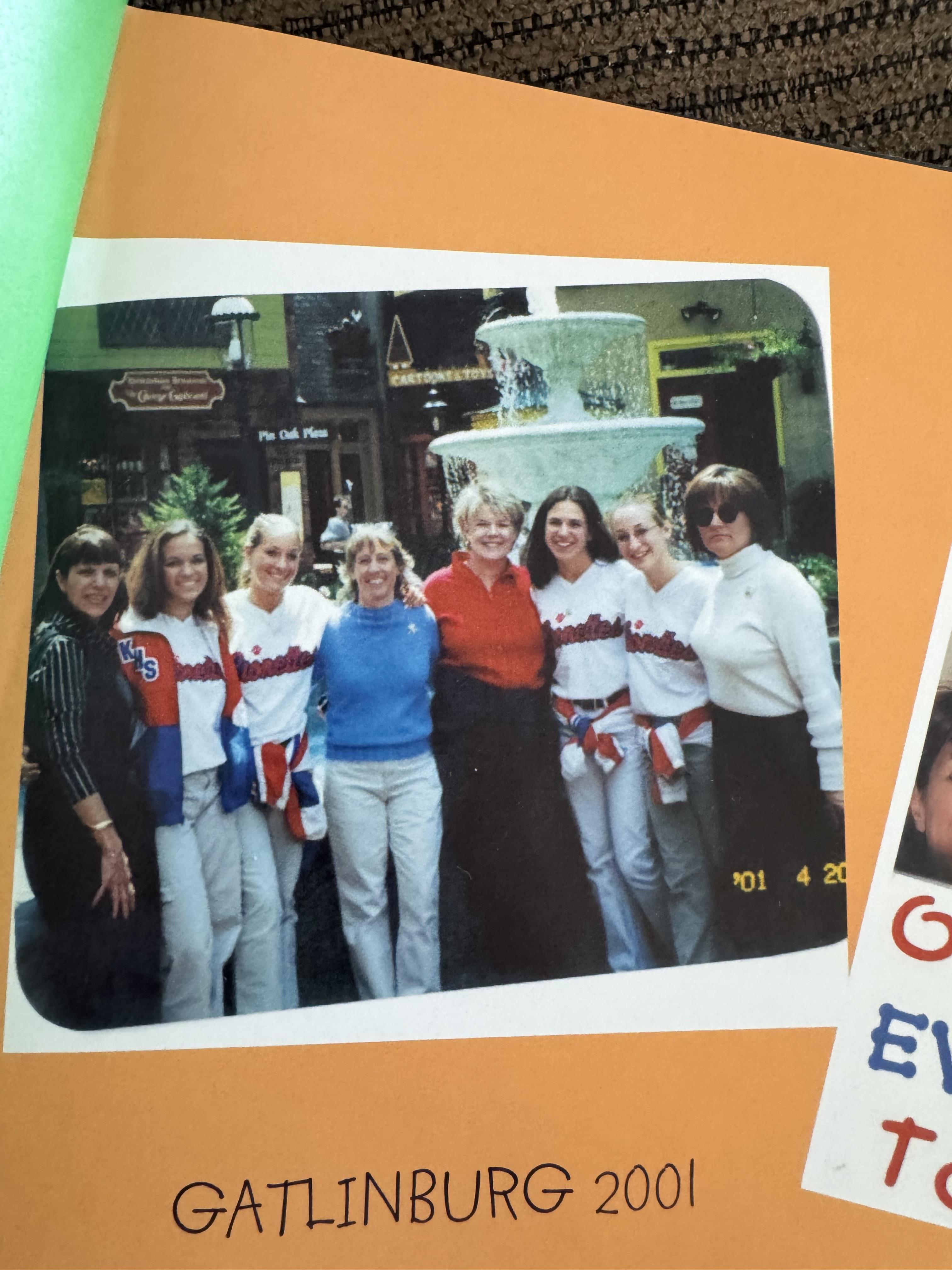 Friends gather for a fun moment by a fountain in Gatlinburg, capturing memories from 2001.