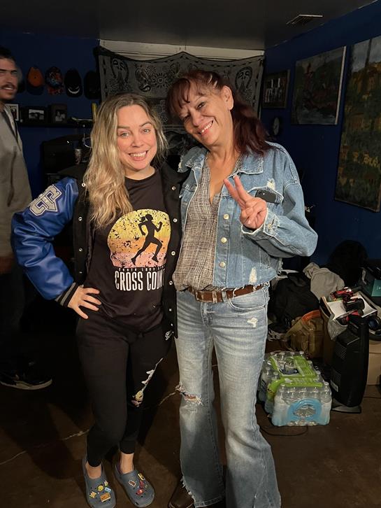 Two women standing together smiling