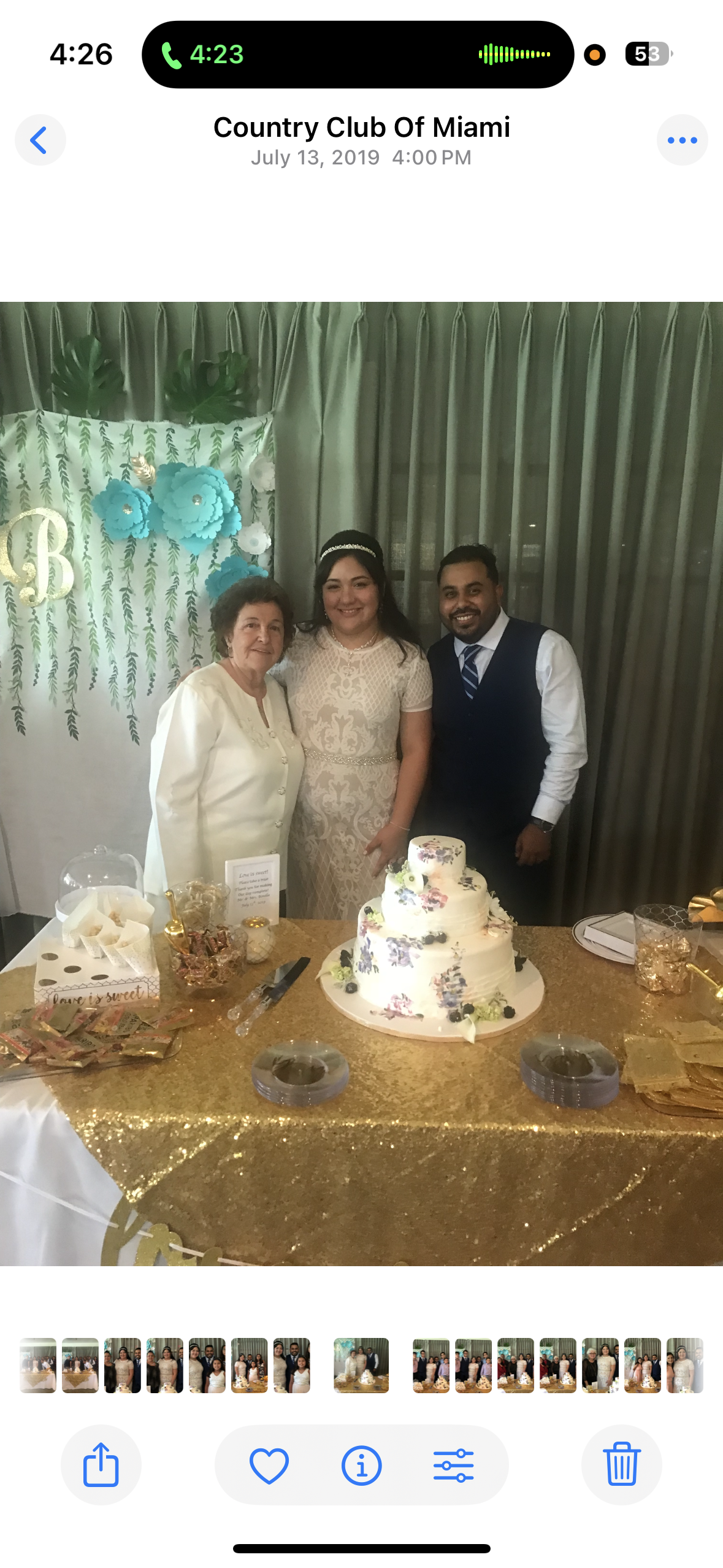 Guests gather around a lavish cake at a celebration in Country Club of Miami, July 13, 2019.