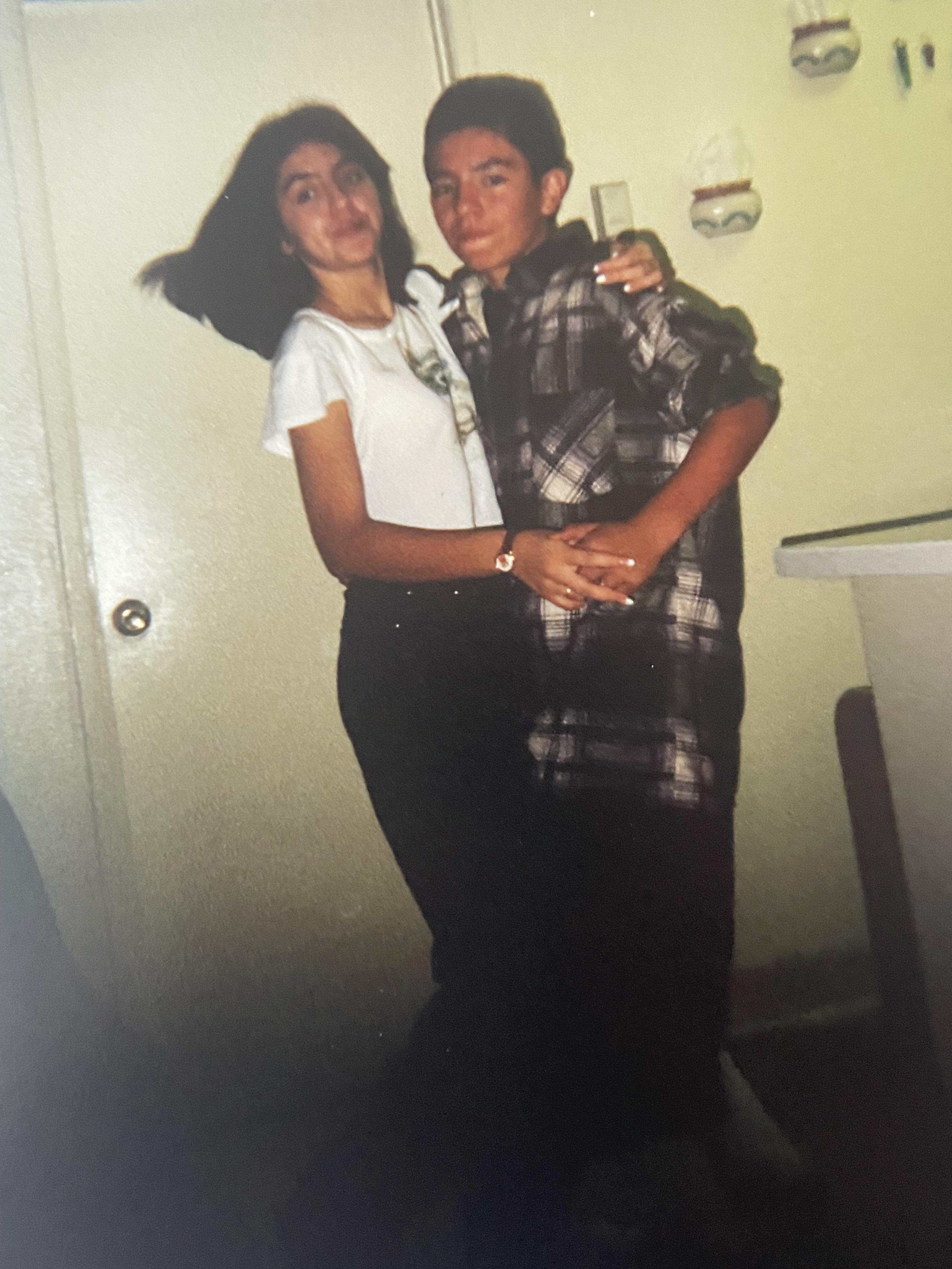 Two teenagers share a playful and happy moment, celebrating friendship in a relaxed atmosphere.