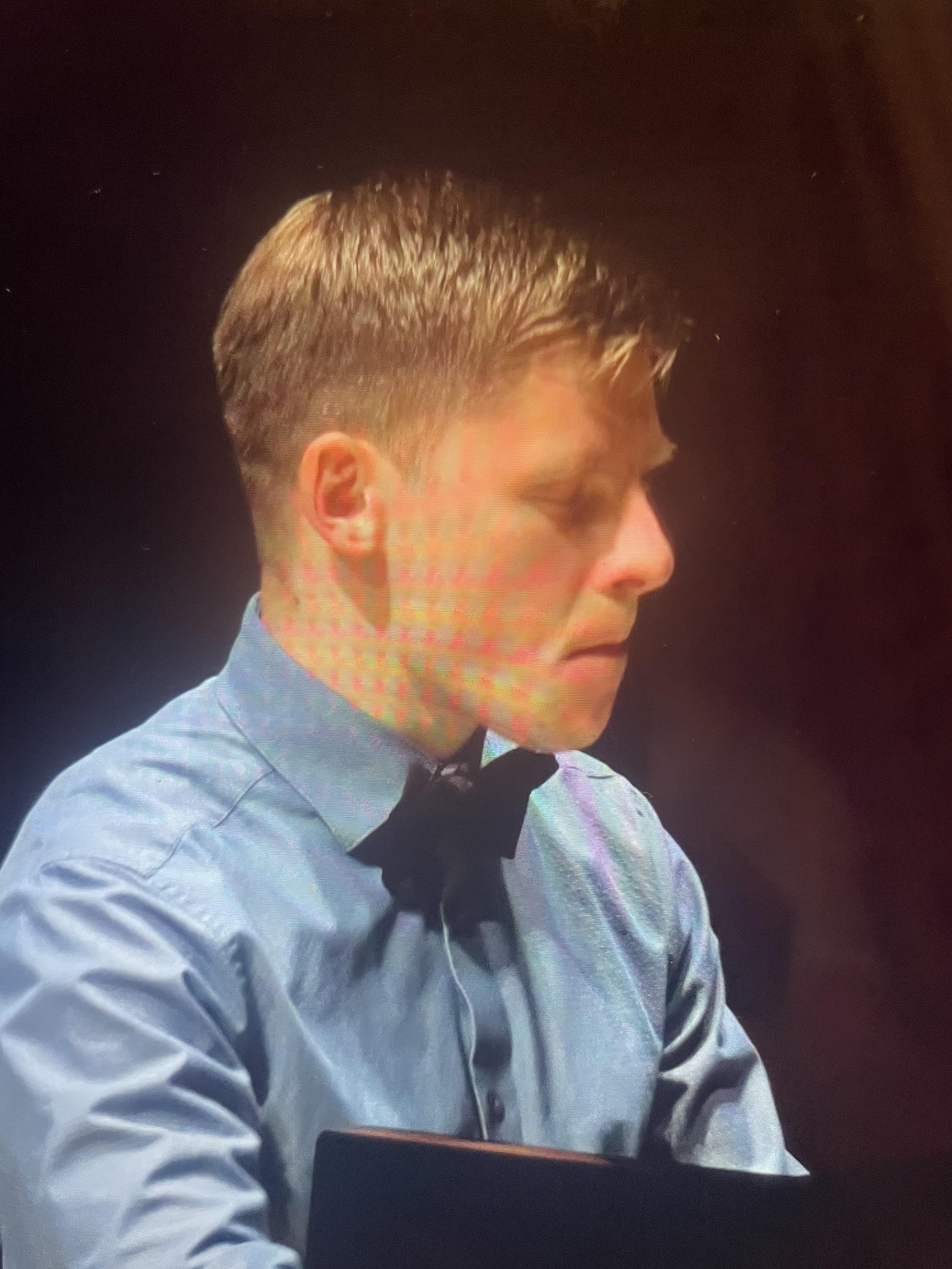 A man in a blue shirt