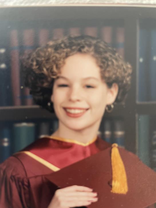 A woman in a graduation gown