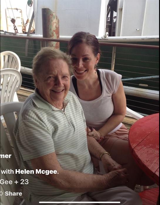 A woman and an older woman sitting at a table