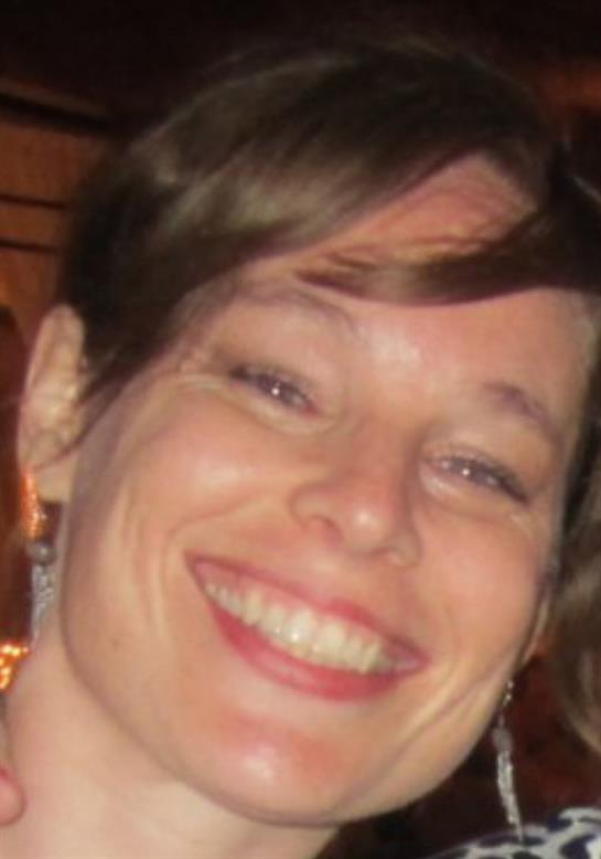 A close up of a woman smiling