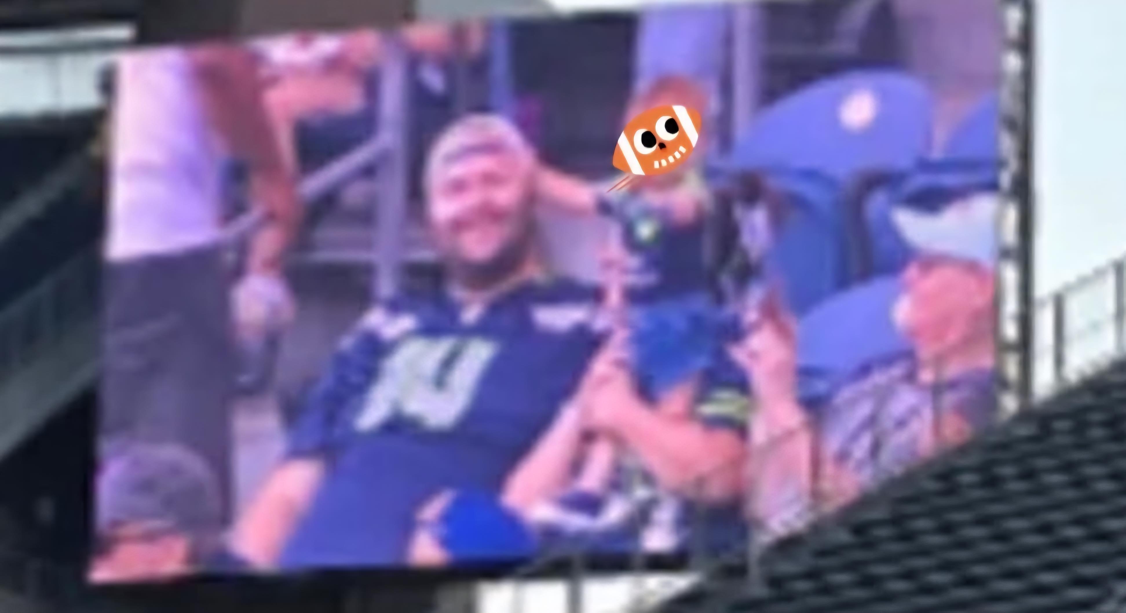 Excited fans cheer for their team in matching jerseys, waving flags.
