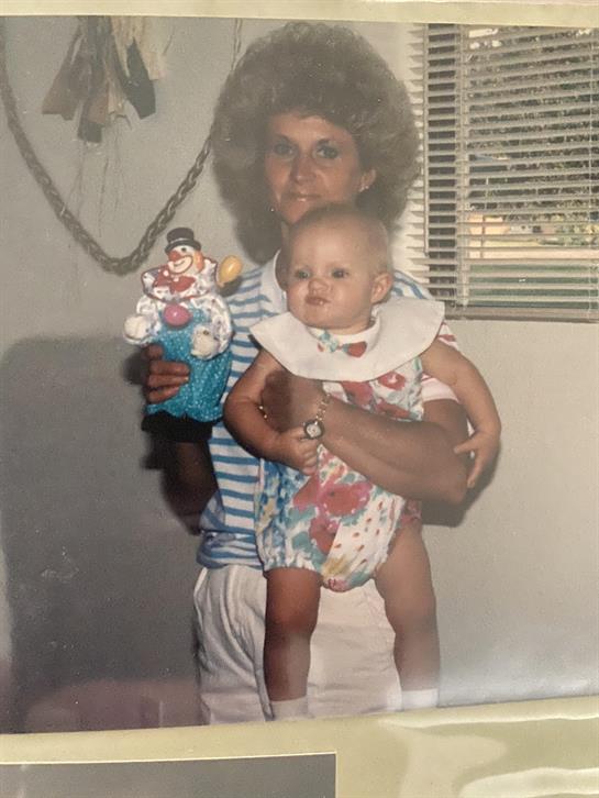 A woman holding a baby