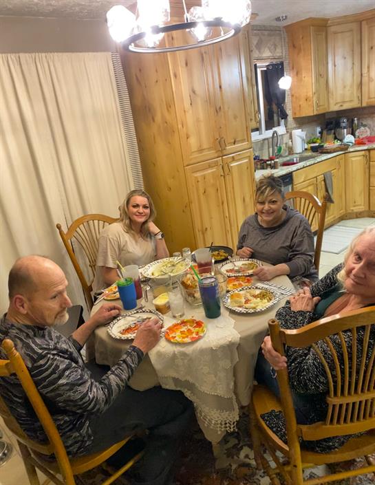 A group of people sitting around a table