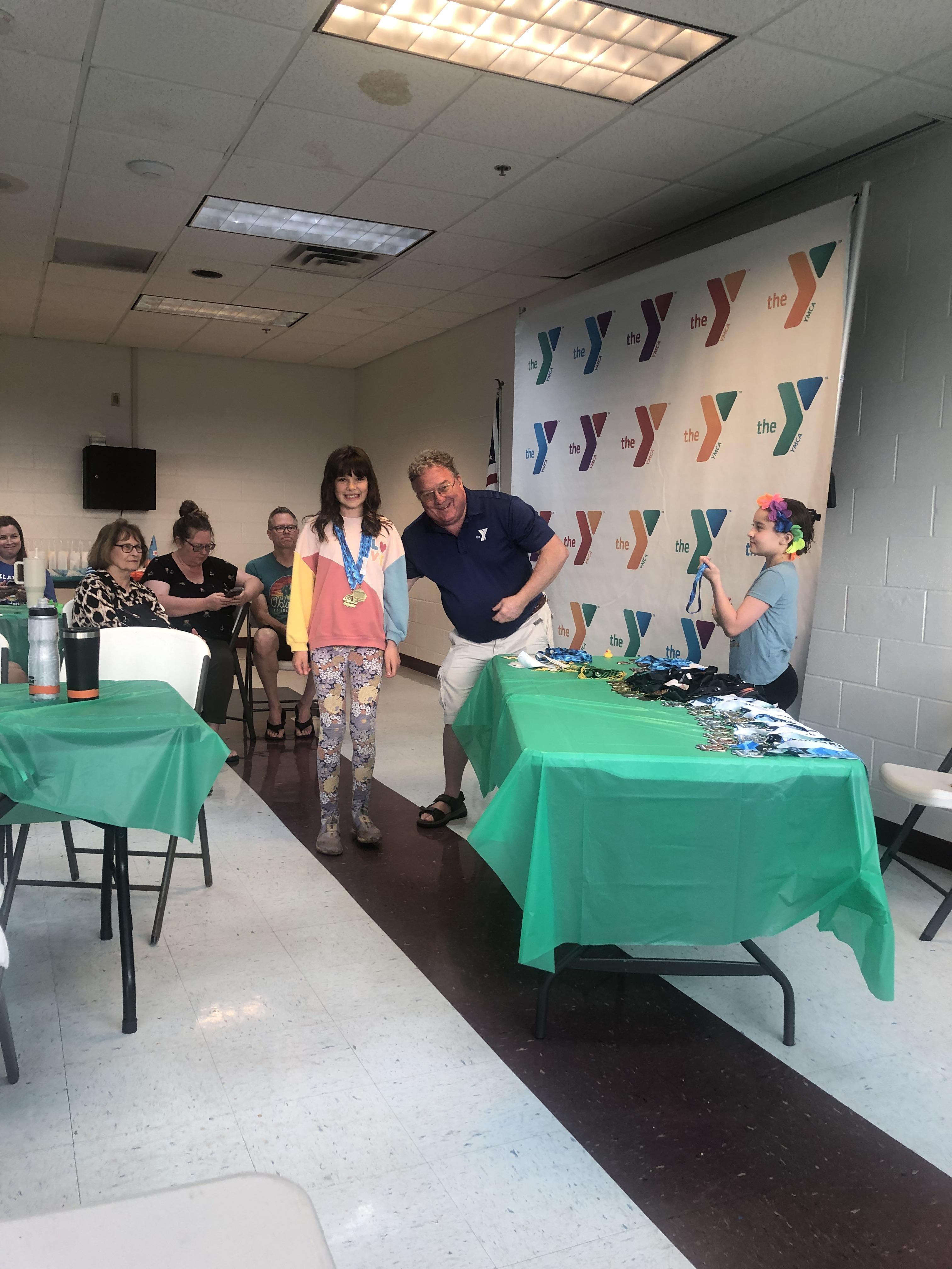 Participants come together to celebrate achievements, share awards, and make memories.