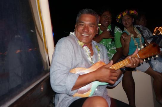 A man playing a ukulele