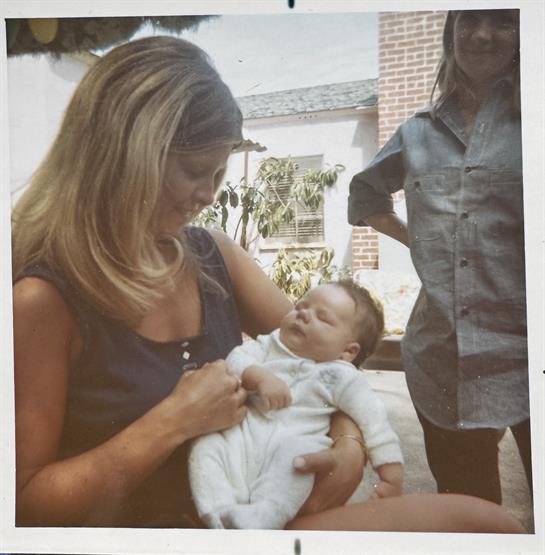 A woman holding a baby
