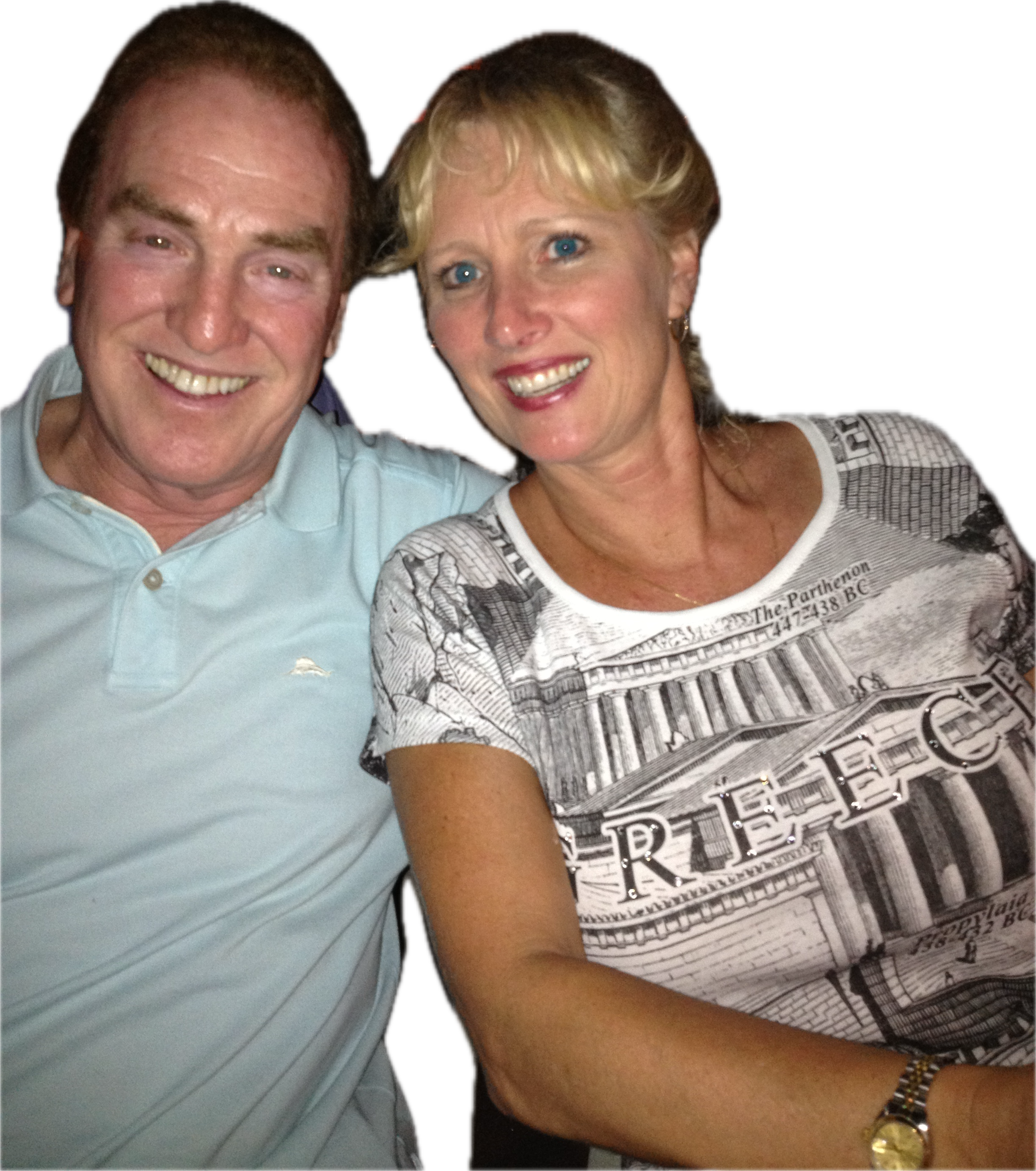 A cheerful couple sits close together, sharing smiles and laughter during a night out.