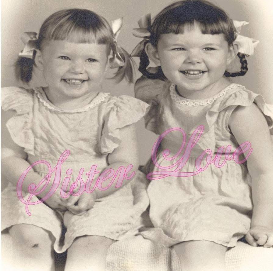 Two young sisters with matching hairstyles pose cheerfully, radiating joy and love.