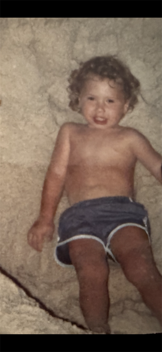 A child lying on a blanket