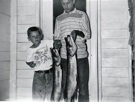 A boy holding a fish
