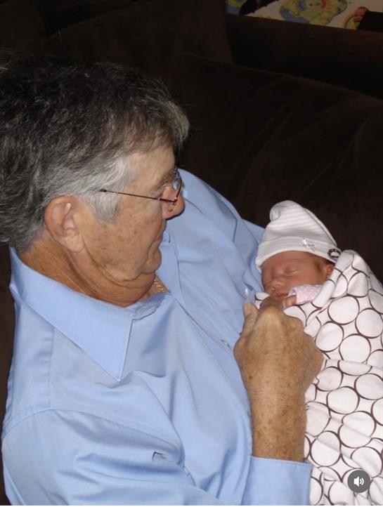A man holding a baby