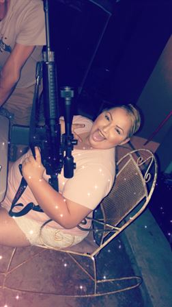 A woman holding a gun