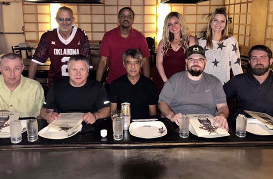 A group of people sitting at a table