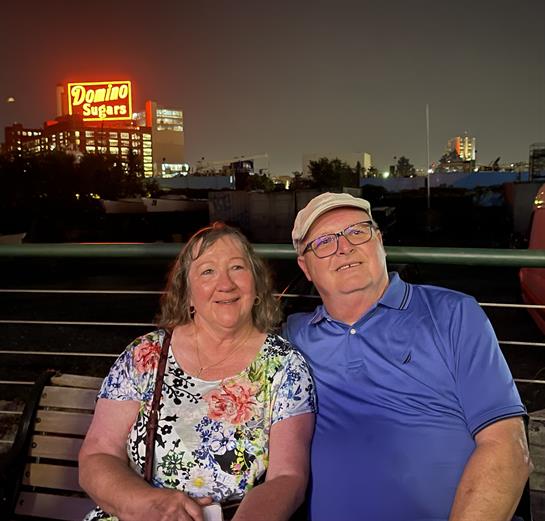 A man and woman sitting on a bench