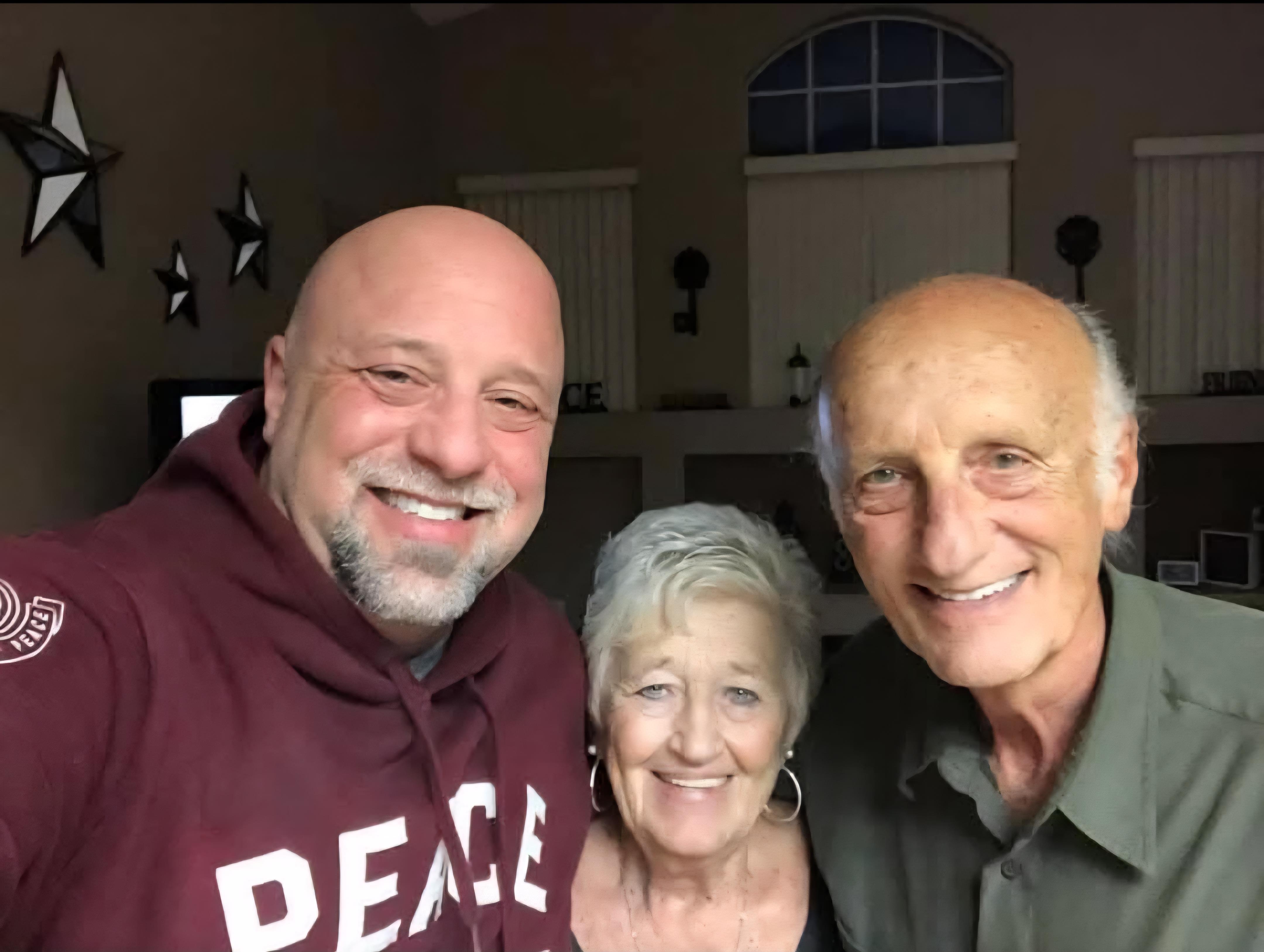 Friends enjoy a joyful moment together while celebrating in a warm home environment.