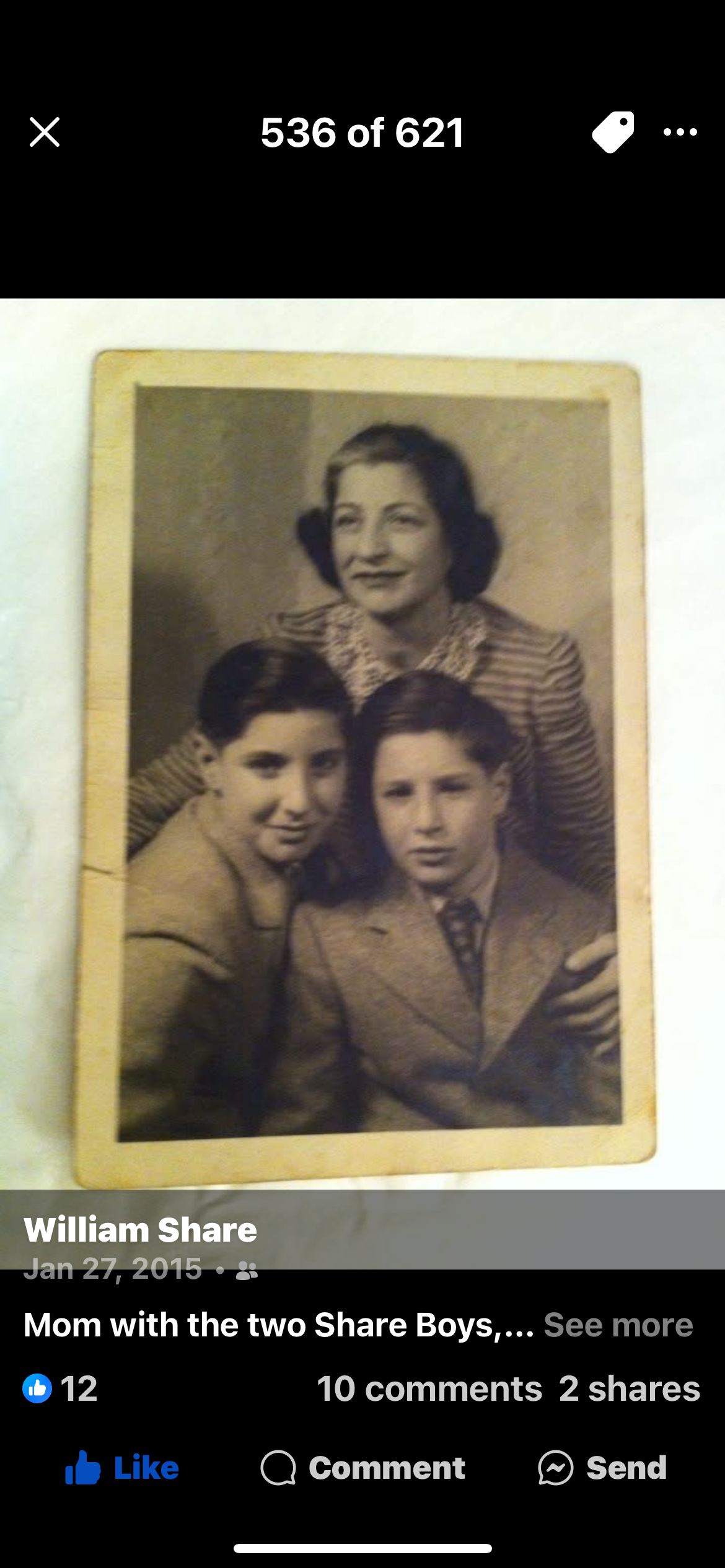 A mother poses affectionately with her two sons in a nostalgic family photograph from the 1950s.