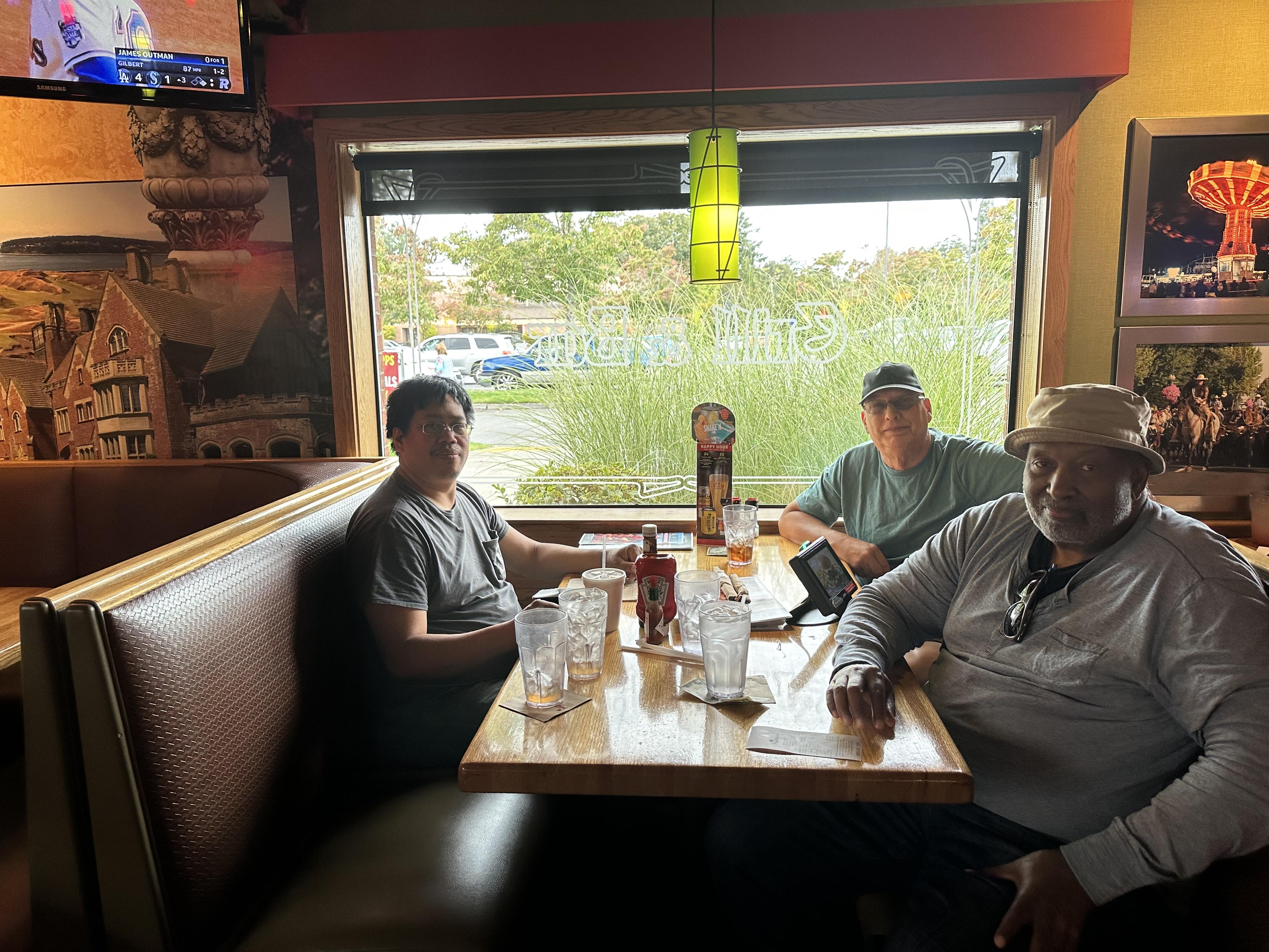 A group of men sitting at a table
