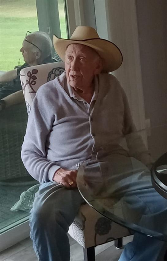 An old man sitting in a chair