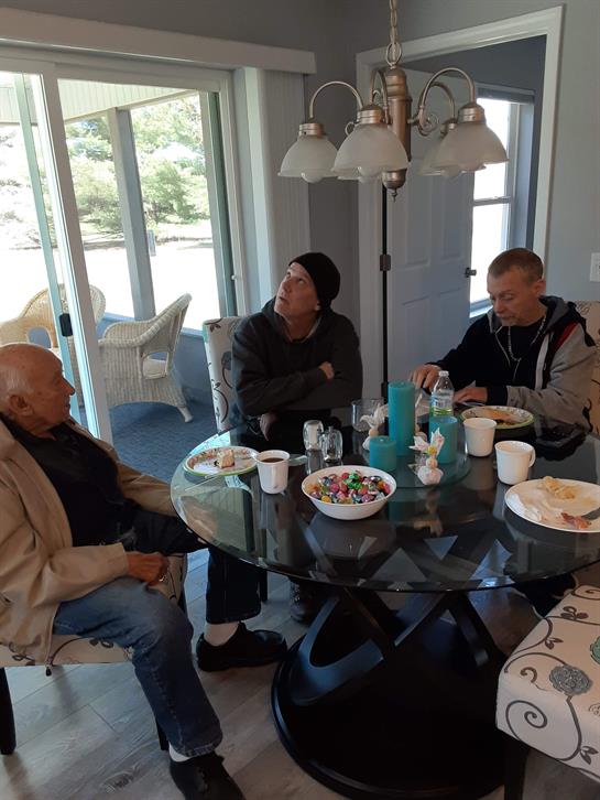 A group of people sitting around a table