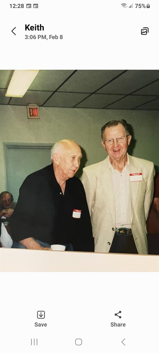 A couple of men standing together