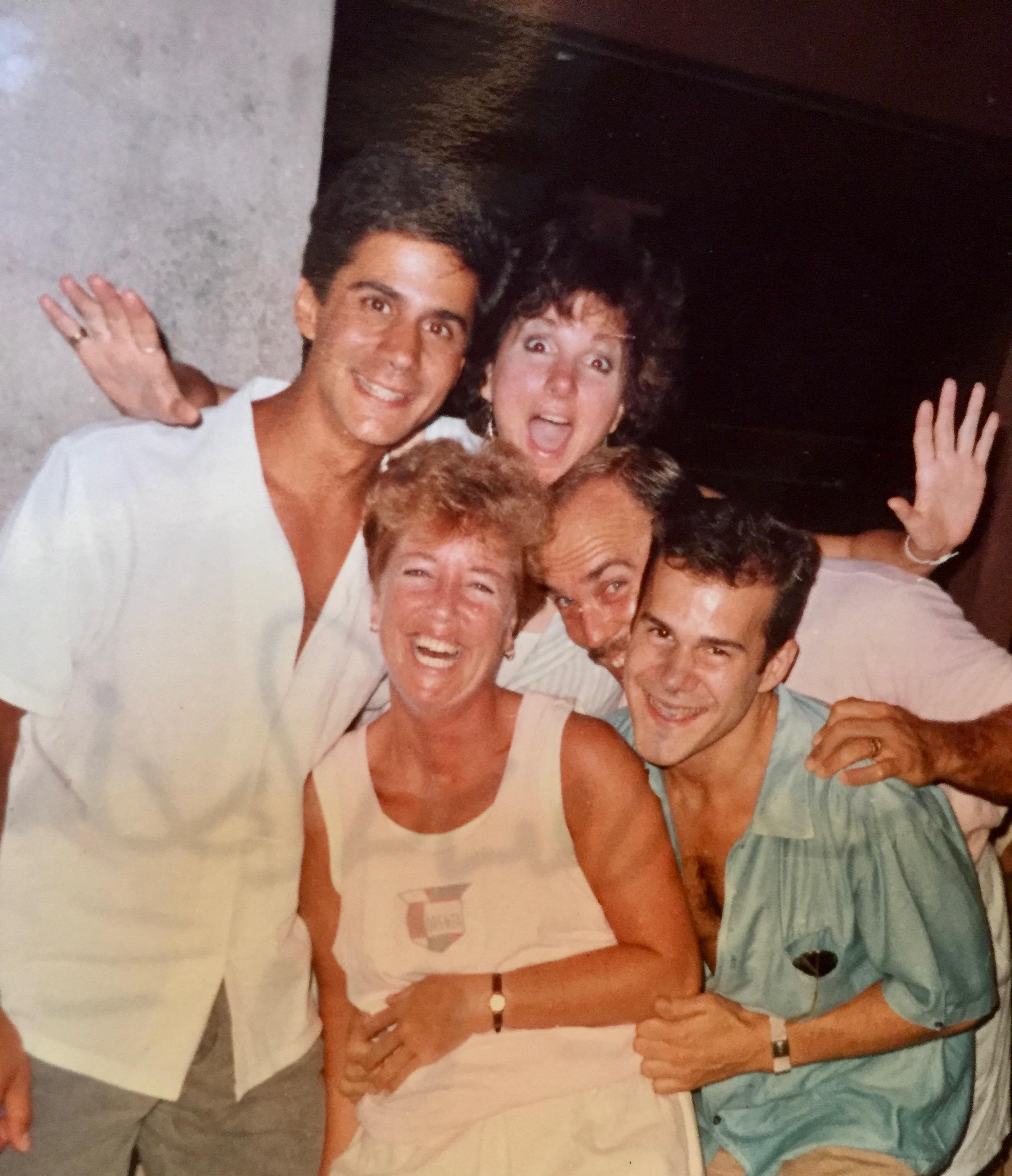 Friends are enjoying a joyful moment together, sharing laughter and smiles in a warm atmosphere.