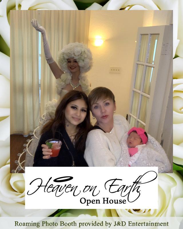 Guests enjoy the open house at Heaven on Earth with costumes, drinks, and a festive atmosphere.