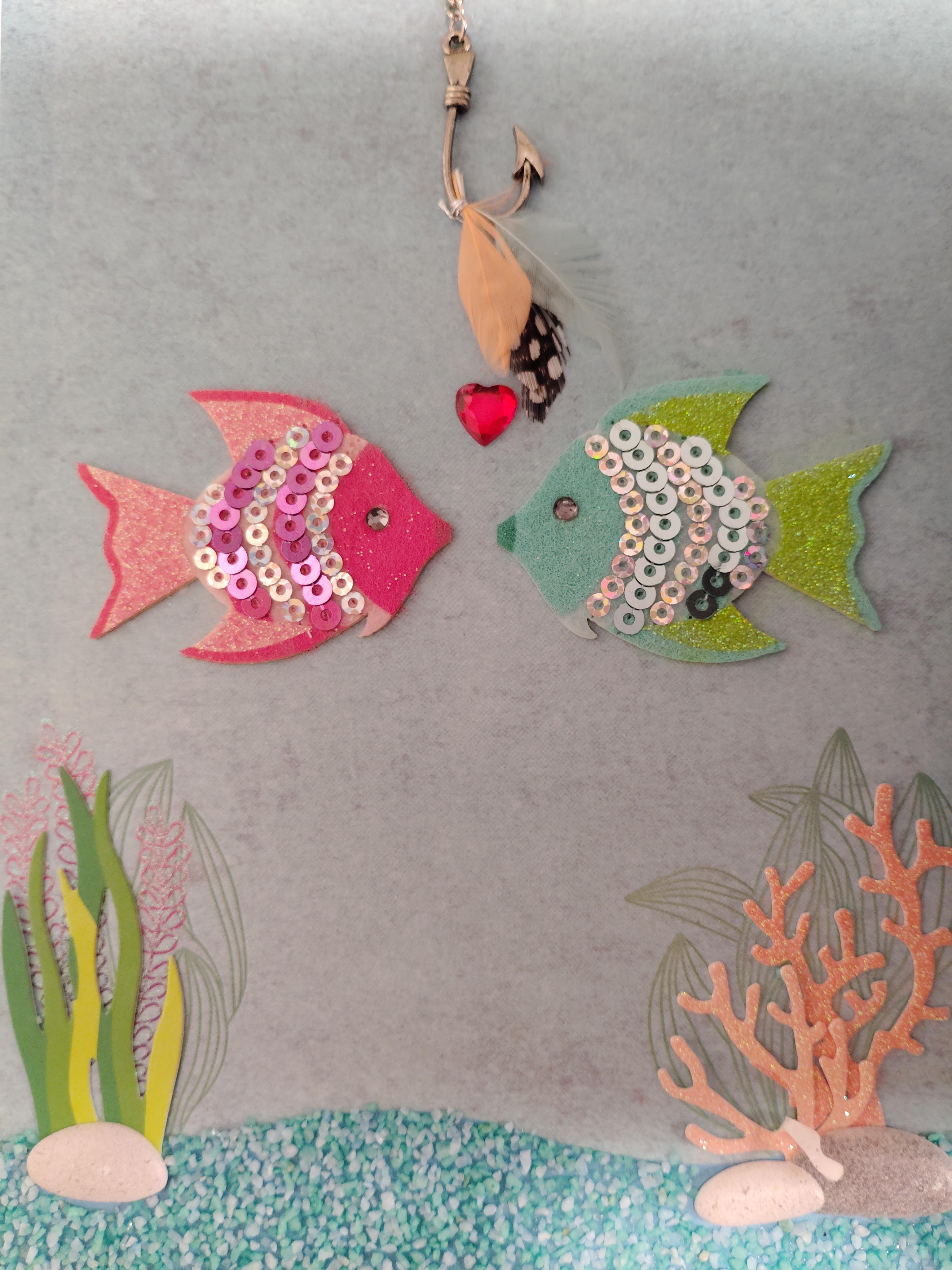 A couple of fish with sequins and beads
