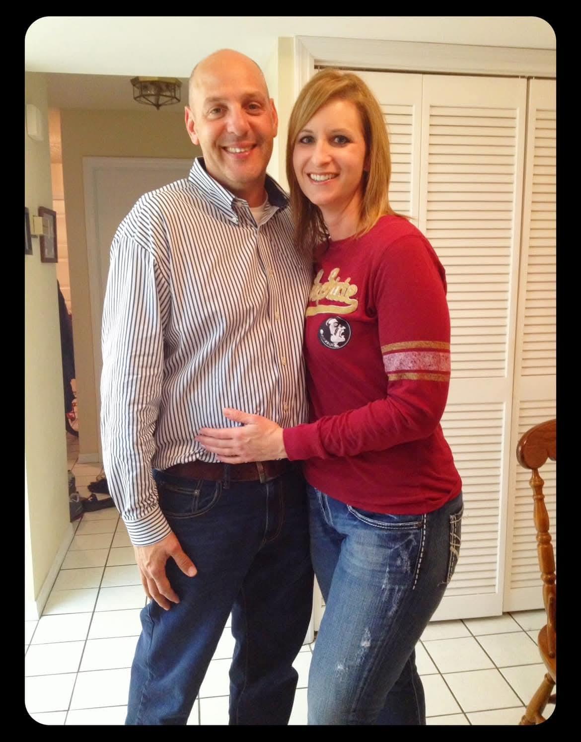 Friends enjoy a joyful moment in a bright kitchen, smiling and celebrating together.